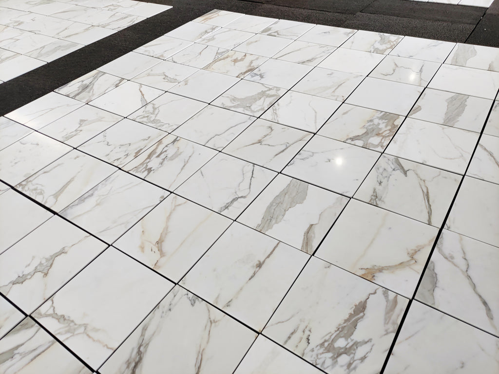 Calacatta Gold Marble-patterned tiles on a floor