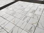 Calacatta Gold Marble-patterned tiles on a floor