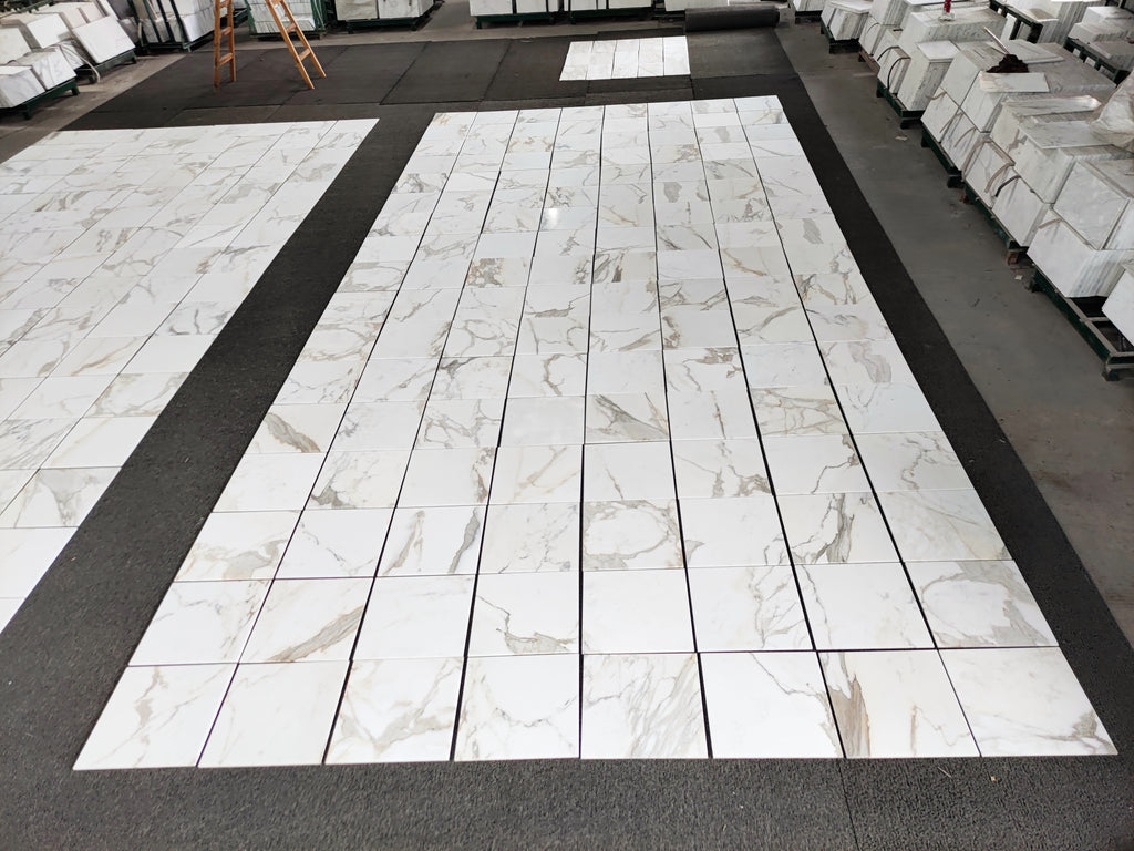 18x18 calacatta gold Italian Marble-patterned tiles on a floor
