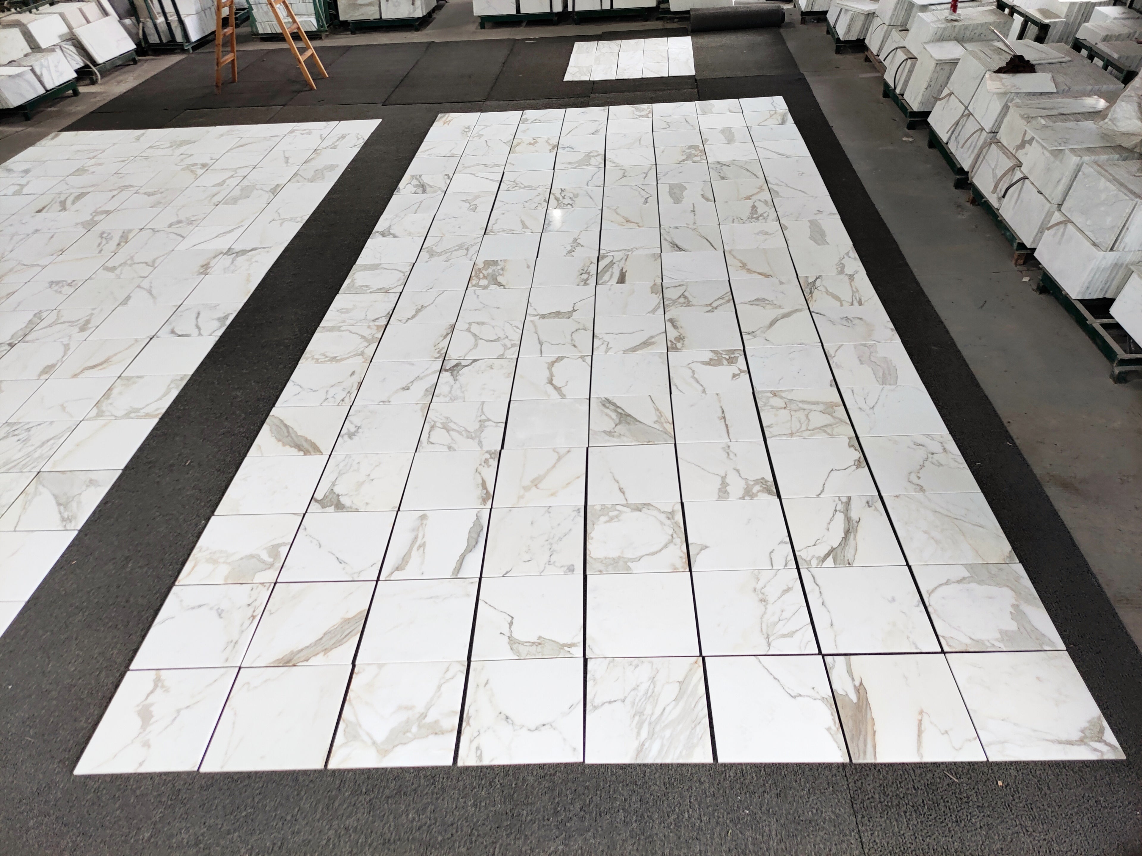 18x18 calacatta gold Italian Marble-patterned tiles on a floor