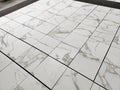 Aria calacatta gold 18x18 Marble-patterned tiles on a floor