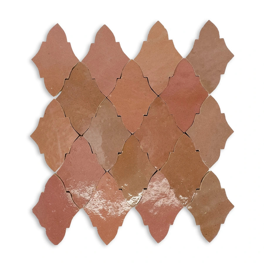 Butterfly zellige mosaic sheet close-up showing multi-tone terracotta variation and handmade texture