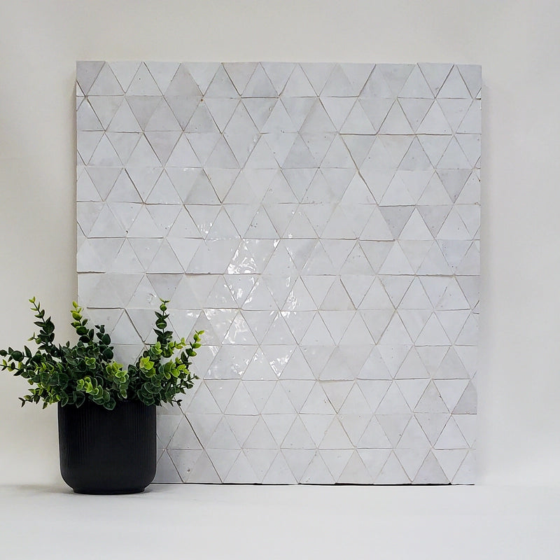 Geometric triangle patterned zellige wall art with a potted plant on a white background. (Heritage Collection)