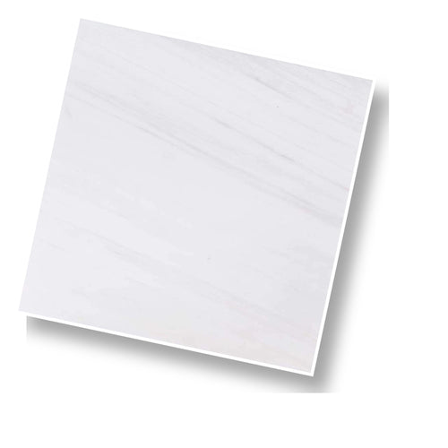 Angled view of Aria Bianco Dolomite 12x12 marble tile highlighting surface character and subtle veining.