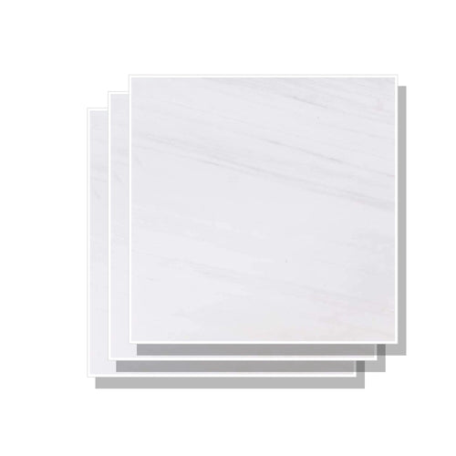 Stacked Aria Bianco Dolomite 12x12 marble tiles showing consistent color range and natural variation across pieces.