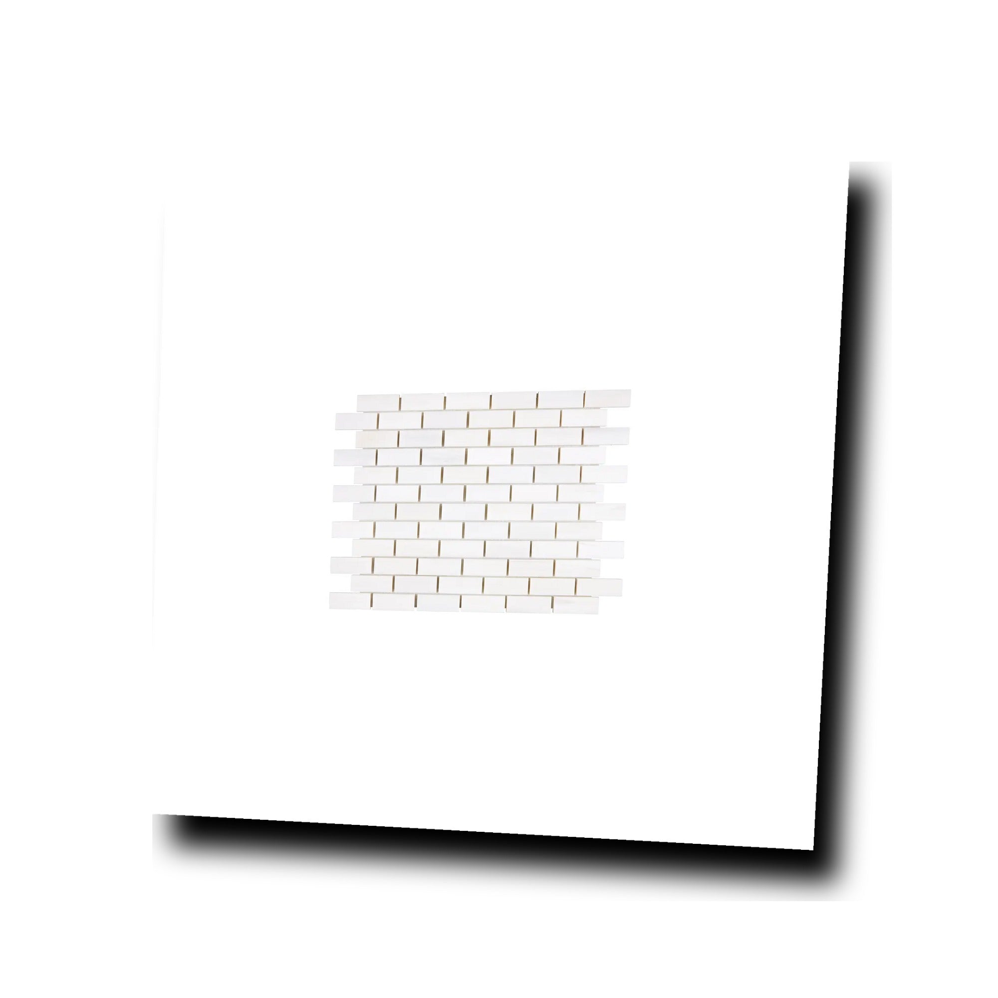 Angled view of Aria Bianco Dolomite 1x2 brick marble mosaic sheet highlighting surface character and subtle veining.
