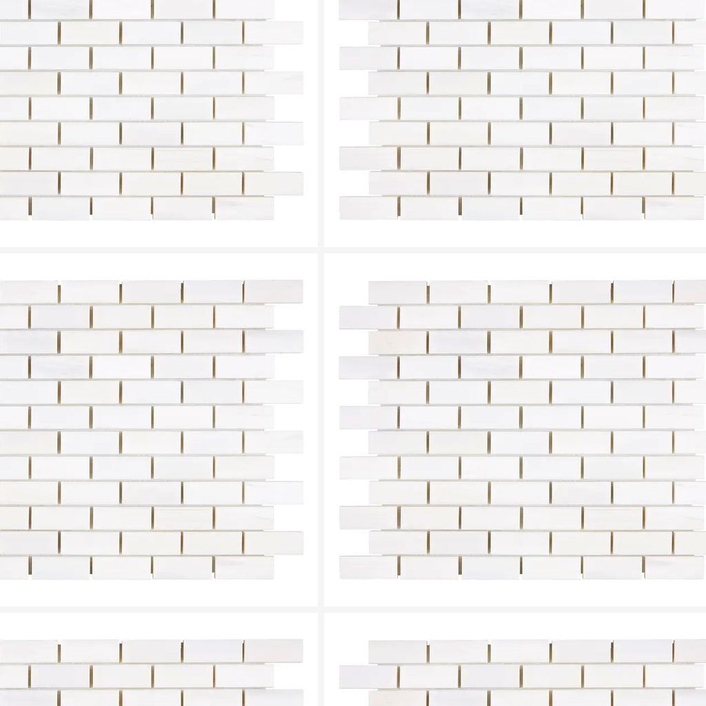 Bianco Dolomite 1x2 brick marble mosaic shown in a running bond layout with light grout for a clean, classic look.
