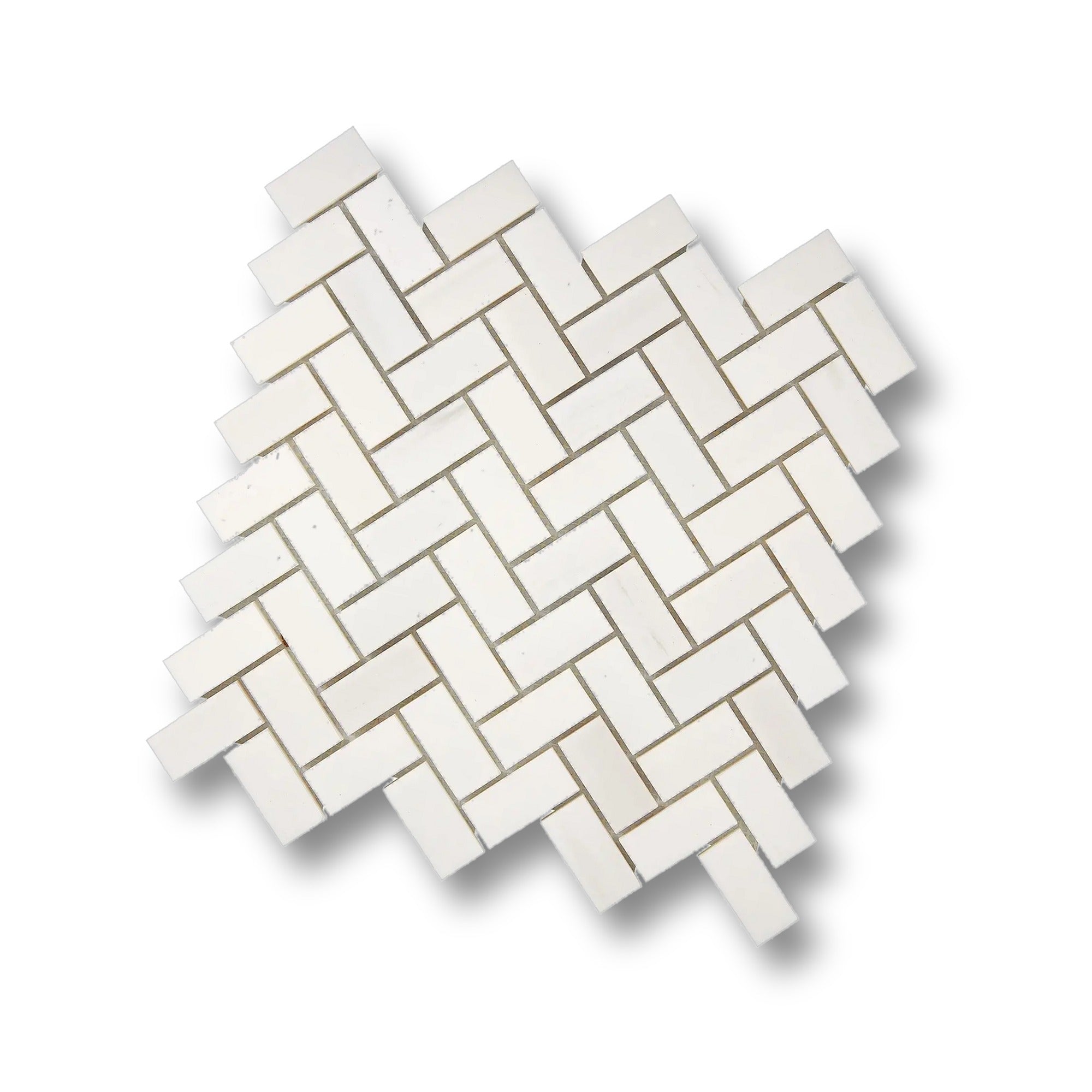 Angled view of Aria Bianco Dolomite 1x2 herringbone mosaic sheet highlighting the pattern and soft natural veining.