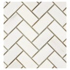 Close-up of Bianco Dolomite 1x2 herringbone marble mosaic showing tile edges, spacing, and natural stone variation.