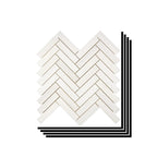 Stacked Aria Bianco Dolomite 1x4 herringbone marble mosaic sheets showing consistent color range and natural variation.