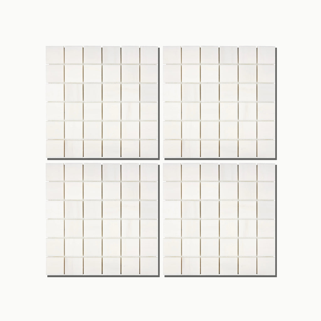 Aria Bianco Dolomite 2x2 marble mosaic shown in a clean grid layout with light grout for a classic wall or floor look.