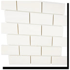 Angled view of Aria Bianco Dolomite 2x4 brick marble mosaic sheet highlighting the pattern and soft natural veining.