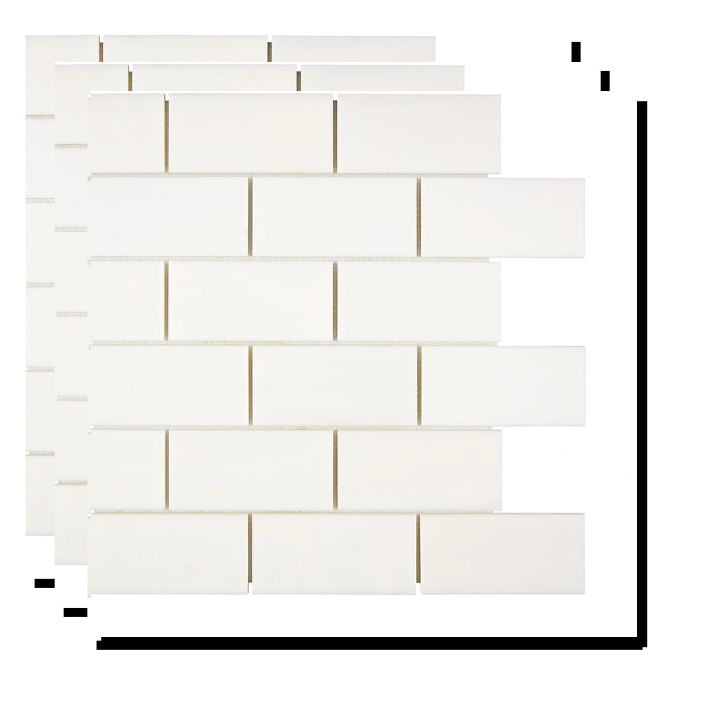 Stacked Aria Bianco Dolomite 2x4 brick marble mosaic sheets showing consistent color range and natural variation.
