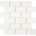 Aria Bianco Dolomite marble mosaic 2x4 brick, square studio image of a mounted sheet with subtle veining and soft tone variation.