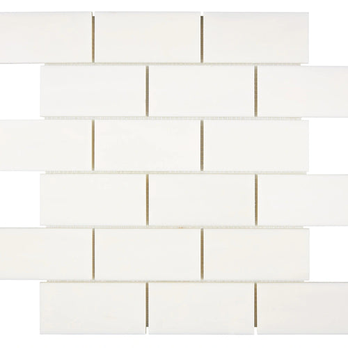 Aria Bianco Dolomite marble mosaic 2x4 brick, square studio image of a mounted sheet with subtle veining and soft tone variation.