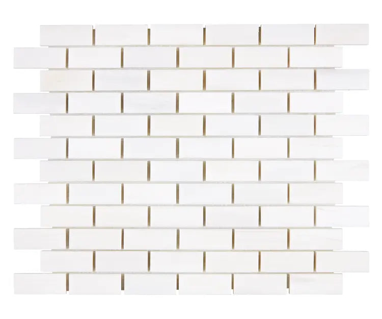 Aria Bianco Dolomite marble mosaic 1x2 brick, studio image of a mounted sheet showing subtle natural veining and soft tone variation.