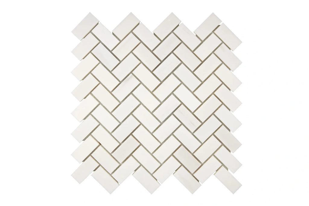 Aria Bianco Dolomite marble mosaic 1x2 brick, studio image of a mounted sheet showing subtle natural veining and soft tone variation.