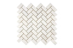 Aria Bianco Dolomite marble mosaic 1x2 brick, studio image of a mounted sheet showing subtle natural veining and soft tone variation.