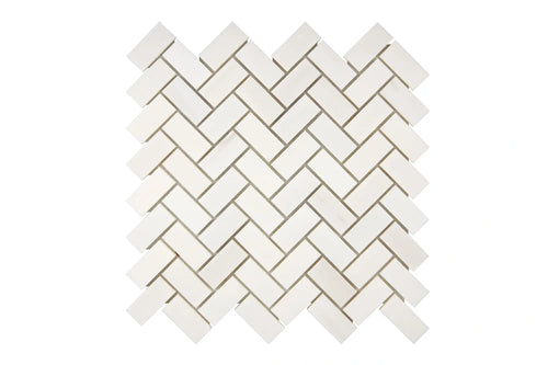 Aria Bianco Dolomite marble mosaic 1x2 brick, studio image of a mounted sheet showing subtle natural veining and soft tone variation.