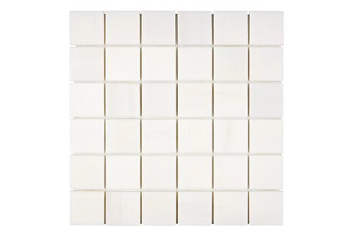 Aria Bianco Dolomite marble mosaic 2x2, studio image of a mounted sheet showing subtle natural veining and soft tone variation.