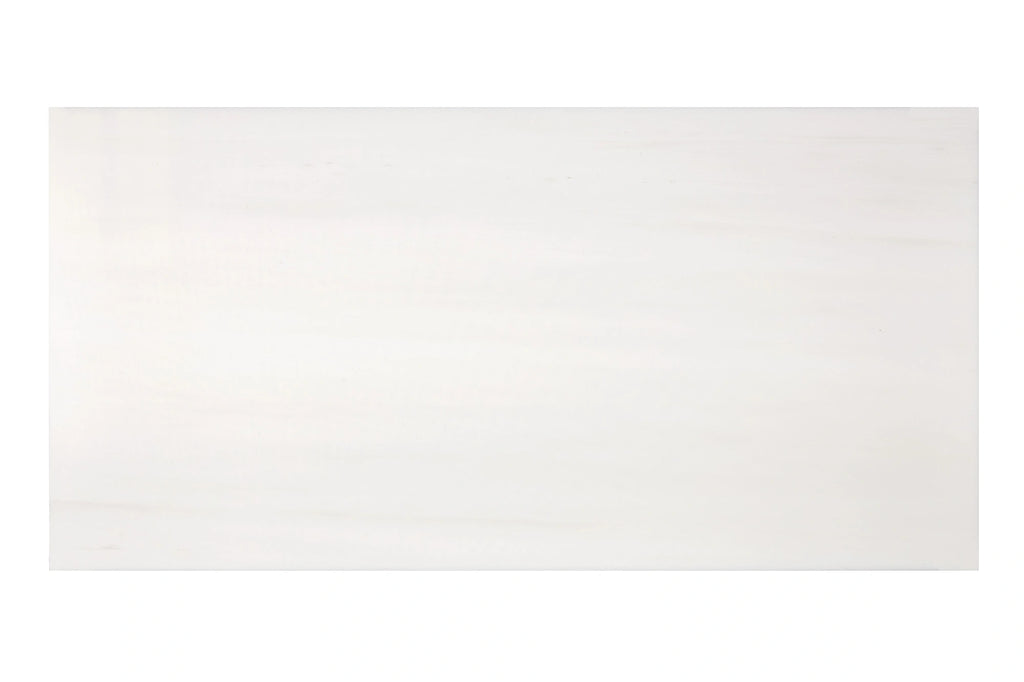 Aria Bianco Dolomite marble tile 12x24, studio image showing light stone with subtle natural veining and soft tone variation.