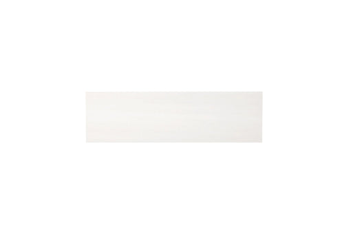 Aria Bianco Dolomite marble tile 4x12, studio image showing a soft white background with delicate natural veining and subtle tone variation.