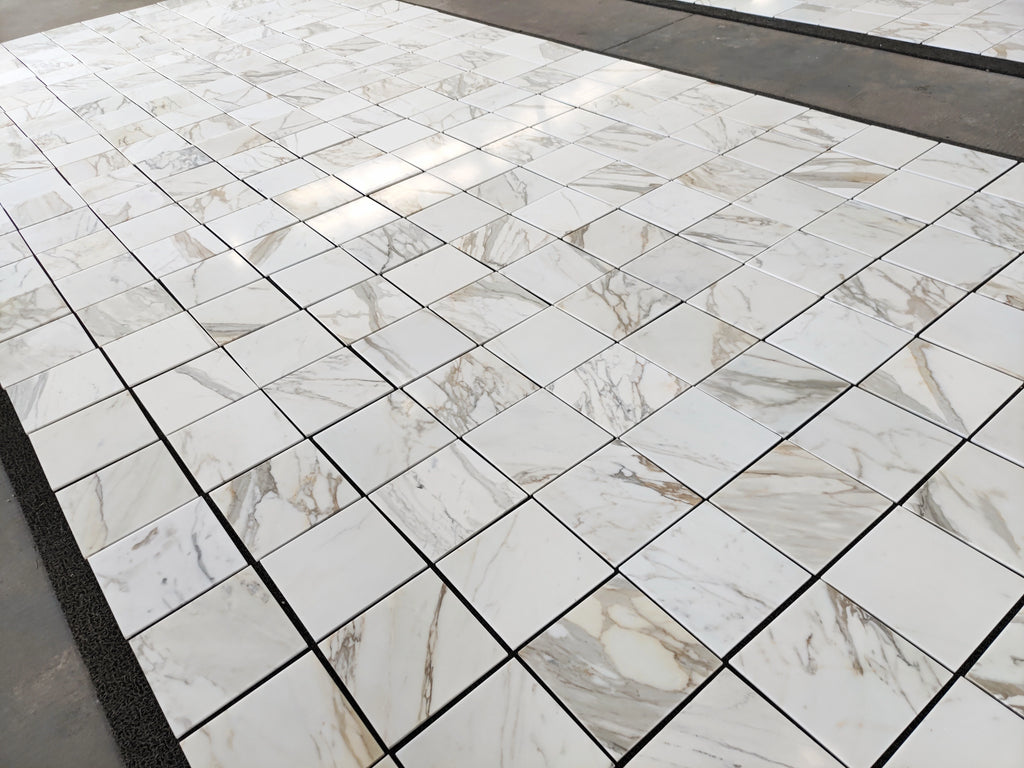calacatta gold 12x12 marble tiles dry-lay for inspection and final project approval