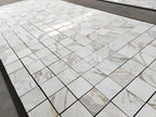 calacatta gold 12x12 marble tiles dry-lay for inspection and final project approval