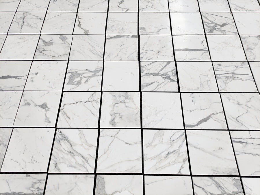 artepierre' s aria calacatta gold 12x12 Marble-patterned tiles arranged in a grid
