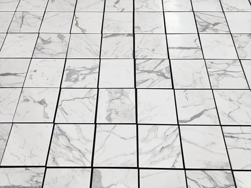 artepierre' s aria calacatta gold 12x12 Marble-patterned tiles arranged in a grid