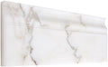 Aria Calacatta Gold marble baseboard trim, studio image showing a molded white marble profile with warm gold veining and subtle gray movement for wall-to-floor transitions.