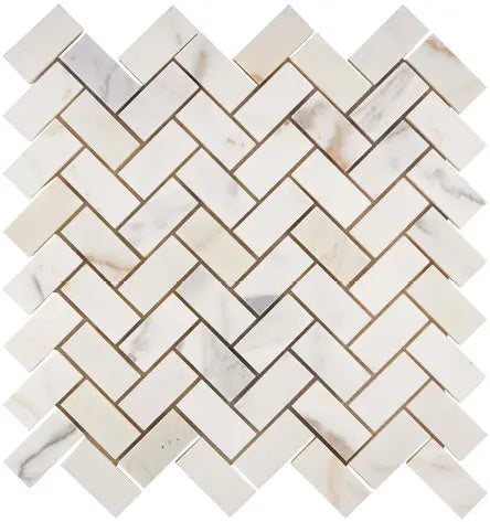 Aria Calacatta Gold marble 1x2 herringbone mosaic sheet, studio image showing a bright white background with warm gold veining and subtle gray movement in a classic herringbone pattern.