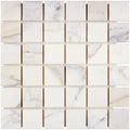 Aria Calacatta Gold marble 2x2 mosaic sheet, studio image showing a bright white background with warm gold veining and subtle gray movement across the mounted grid.