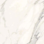 Aria Calacatta Gold marble tile 12x12, studio image showing a bright white background with warm gold veining and soft gray movement with natural variation.