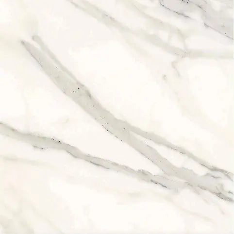 Aria Calacatta Gold marble tile 18x18, studio image showing a bright white background with warm gold veining and soft gray movement with natural variation.