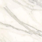 Aria Calacatta Gold marble tile 18x18, studio image showing a bright white background with warm gold veining and soft gray movement with natural variation.