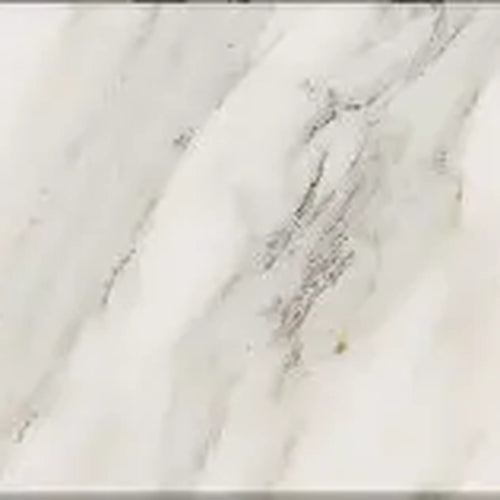 Close-up of a Calacatta Gold 4x4 marble surface with gray and white patterns.