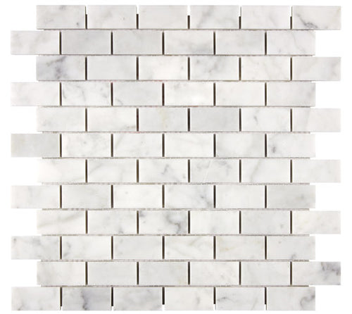 Aria Carrara White marble 1x2 brick mosaic sheet, studio image showing bright white stone with soft gray veining and natural variation in a clean running-bond layout.