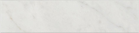 Aria Carrara White marble subway tile 2x8, studio image showing a bright white base with soft gray veining and natural variation for timeless backsplashes, shower walls, and classic wainscoting.