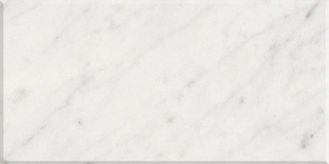 White marble tile with subtle gray veining on a white background