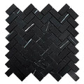 Aria Nero Marquina black marble 1x2 herringbone mosaic sheet, studio image showing deep black stone with bold white veining and natural high-contrast variation in a classic herringbone pattern.