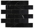 Aria Nero Marquina black marble 2x4 brick mosaic sheet, studio image showing deep black stone with bold white veining and natural high-contrast variation across the mounted pattern.