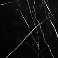 Aria Nero Marquina black marble tile 12x12, studio image showing deep black stone with bold white veining and natural high-contrast variation for dramatic walls, floors, and graphic accents.
