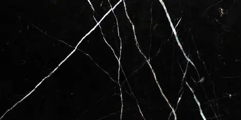 Aria Nero Marquina black marble tile 12x24, studio image showing deep black stone with bold white veining and natural high-contrast variation