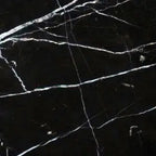 Aria Nero Marquina black marble tile 18x18, studio image showing deep black stone with bold white veining and natural high-contrast variation for dramatic floors, feature walls, and statement spaces.