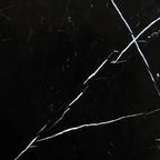 Aria Nero Marquina black marble tile 24x24, studio image showing deep black stone with bold white veining and natural high-contrast variation for dramatic floors, feature walls, and statement spaces.