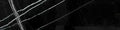 Aria Nero Marquina black marble subway tile 2x8, studio image showing deep black stone with bold white veining and natural high-contrast variation.
