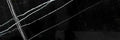 Aria Nero Marquina black marble tile 4x12, studio image showing deep black stone with bold white veining and natural high-contrast variation for statement walls, floors, and backsplashes.