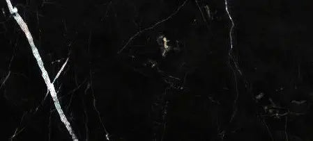Close up Aria Nero Marquina black marble tile 6x12, showing deep black stone with bold white veining and natural high-contrast variation for statement walls, floors, and backsplashes.