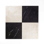 Checkered pattern of black and beige tiles on a white background